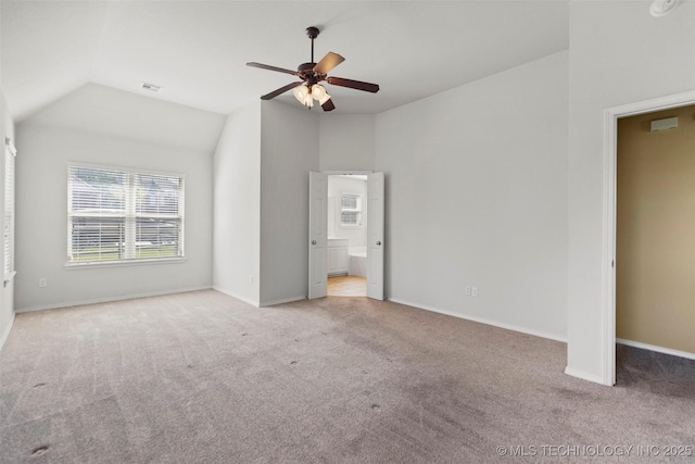 2000 W Vail St, Broken Arrow, OK 74012 - unfurnished bedroom with carpet floors, multiple windows, vaulted ceiling, and baseboards