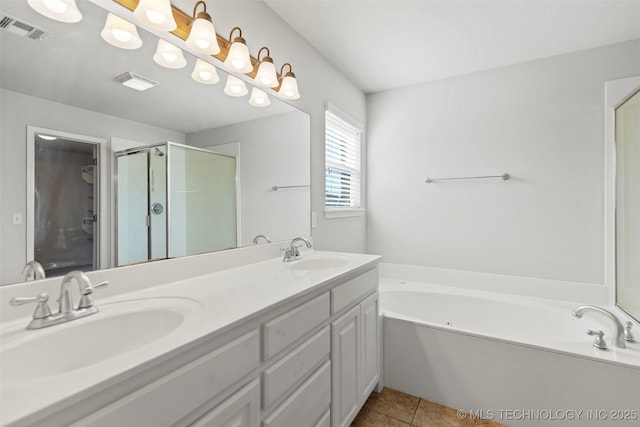 2000 W Vail St, Broken Arrow, OK 74012 - bathroom with a garden tub, double vanity, a shower stall, and tile patterned flooring