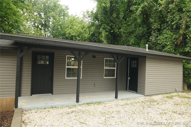 1185 E Pine St, Westville, OK 74965 - view of exterior entry with a porch