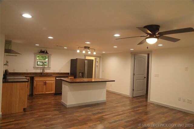 1185 E Pine St, Westville, OK 74965 - kitchen with stainless steel appliances, wall chimney exhaust hood, a sink, recessed lighting, and a kitchen island
