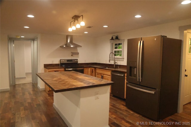 1185 E Pine St, Westville, OK 74965 - kitchen with stainless steel appliances, wall chimney range hood, butcher block counters, a sink, and recessed lighting