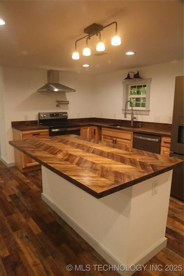 1185 E Pine St, Westville, OK 74965 - kitchen featuring butcher block countertops, appliances with stainless steel finishes, wall chimney range hood, a sink, and dark wood-style floors