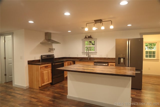 1185 E Pine St, Westville, OK 74965 - kitchen with appliances with stainless steel finishes, butcher block counters, a sink, wall chimney range hood, and dark wood finished floors