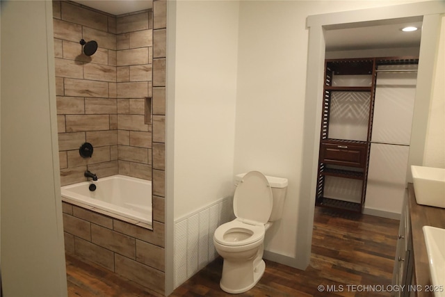 1185 E Pine St, Westville, OK 74965 - bathroom featuring wood finished floors, toilet, tiled shower / bath, vanity, and recessed lighting
