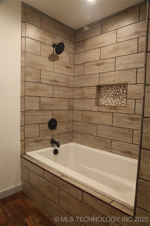 1185 E Pine St, Westville, OK 74965 - bathroom with wood finished floors, a combined bath / shower with jetted tub, and baseboards