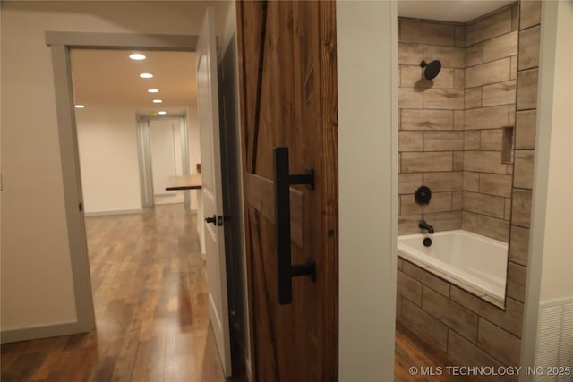 1185 E Pine St, Westville, OK 74965 - full bathroom with wood finished floors, recessed lighting, and tiled shower / bath