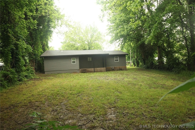 1185 E Pine St, Westville, OK 74965 - back of property with a yard and entry steps