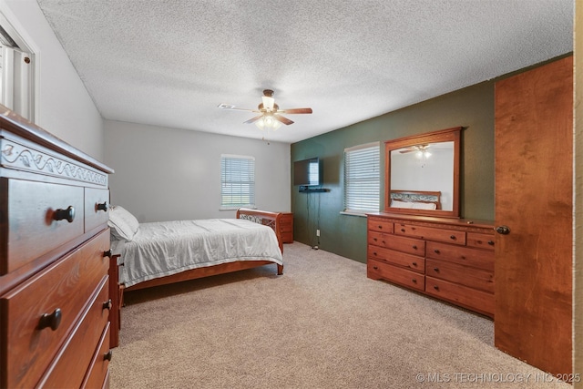 5378 W 450th Rd, Pryor, OK 74361 - bedroom with carpet, a textured ceiling, and ceiling fan