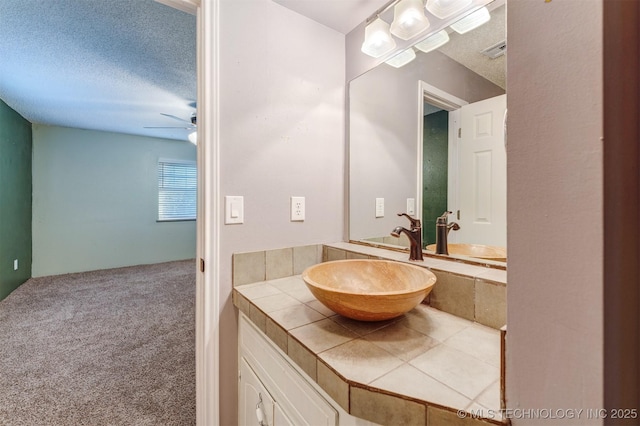 5378 W 450th Rd, Pryor, OK 74361 - bathroom featuring a ceiling fan, a textured ceiling, and vanity