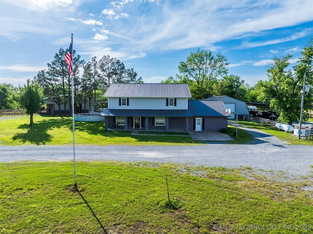 5378 W 450th Rd, Pryor, OK 74361 - country-style home with metal roof, a front yard, and a porch