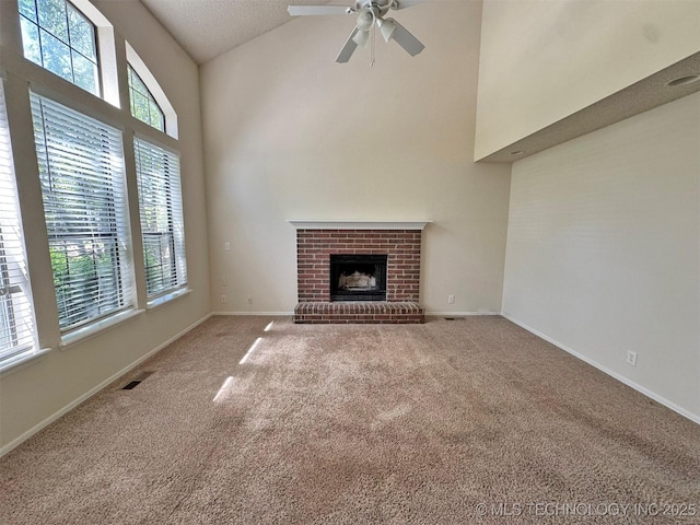 7333 W 36th St, Tulsa, OK 74107 - unfurnished living room featuring high vaulted ceiling, carpet, a ceiling fan, a fireplace, and baseboards
