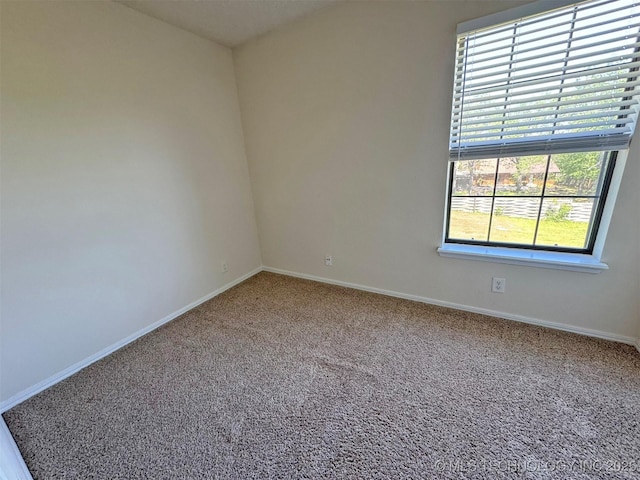 7333 W 36th St, Tulsa, OK 74107 - spare room featuring carpet floors and baseboards
