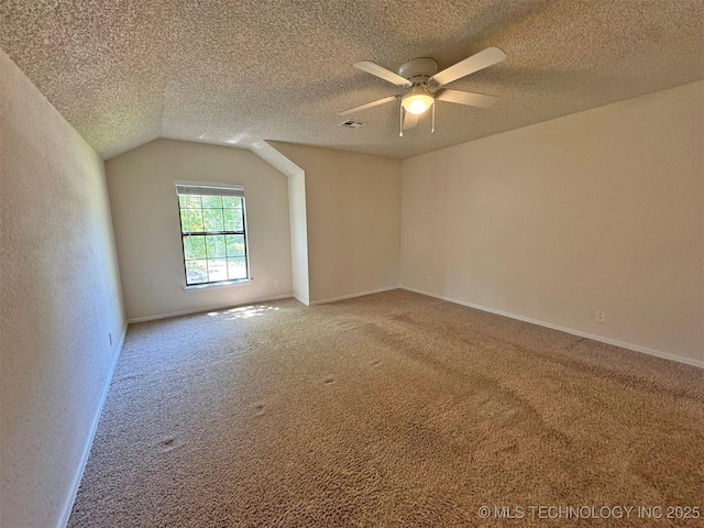 7333 W 36th St, Tulsa, OK 74107 - empty room with light carpet, a ceiling fan, a textured ceiling, baseboards, and lofted ceiling