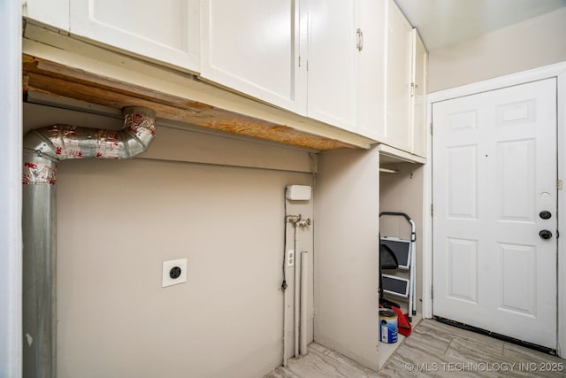 1648 S Columbia Pl, Tulsa, OK 74104 - laundry area with cabinet space and hookup for an electric dryer