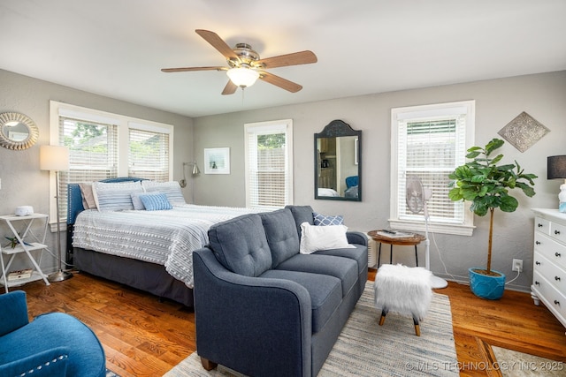 1648 S Columbia Pl, Tulsa, OK 74104 - bedroom featuring wood finished floors, ceiling fan, and baseboards