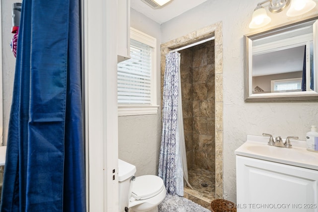 1648 S Columbia Pl, Tulsa, OK 74104 - bathroom featuring toilet, a stall shower, a textured wall, and vanity