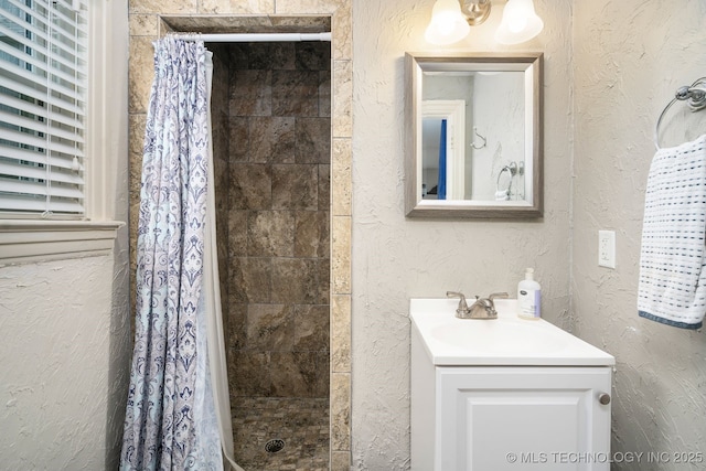 1648 S Columbia Pl, Tulsa, OK 74104 - full bath featuring a textured wall, a shower stall, and vanity