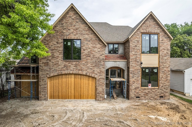 view of front of property featuring brick siding, crawl space, a shingled roof, and an attached garage