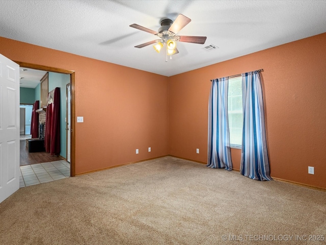 1310 Prairie Heights Dr, Bartlesville, OK 74006 - carpeted empty room with a ceiling fan and baseboards