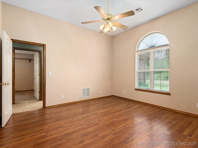 1310 Prairie Heights Dr, Bartlesville, OK 74006 - unfurnished room featuring wood finished floors, a ceiling fan, and baseboards
