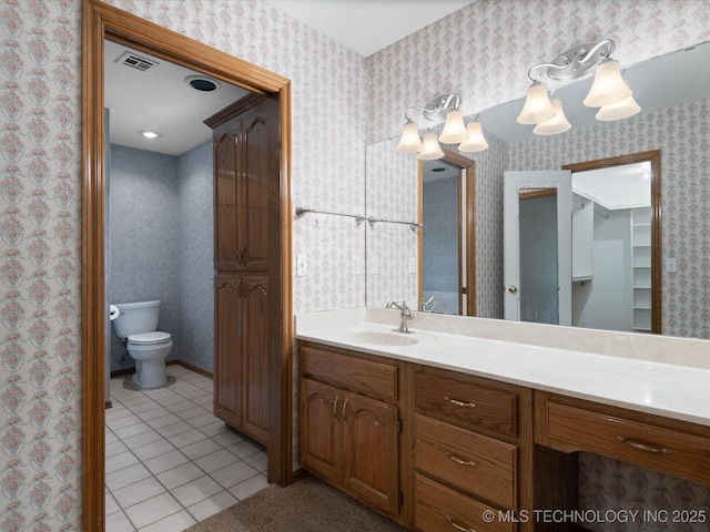 1310 Prairie Heights Dr, Bartlesville, OK 74006 - bathroom with tile patterned floors, vanity, toilet, and wallpapered walls