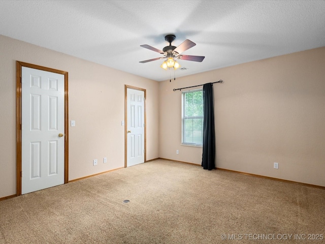 1310 Prairie Heights Dr, Bartlesville, OK 74006 - unfurnished room featuring light colored carpet, ceiling fan, and baseboards