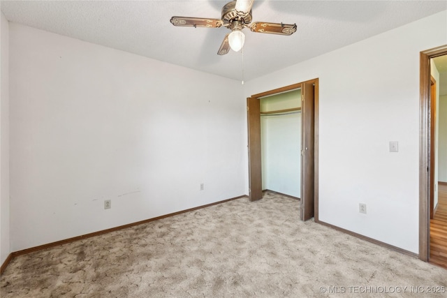 20600 Slick Rd, Kellyville, OK 74039 - unfurnished bedroom with carpet, baseboards, a ceiling fan, and a closet