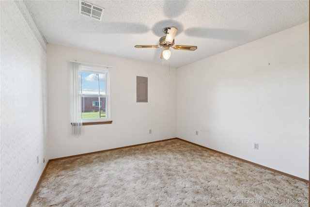 20600 Slick Rd, Kellyville, OK 74039 - carpeted spare room featuring a ceiling fan, electric panel, a textured ceiling, and baseboards