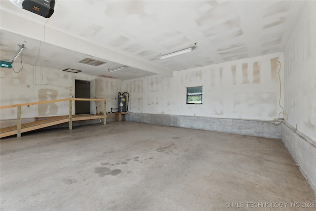 20600 Slick Rd, Kellyville, OK 74039 - garage with electric water heater and a garage door opener