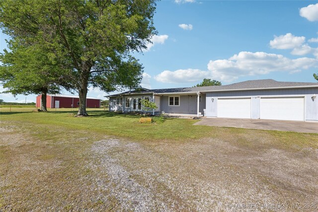 20600 Slick Rd, Kellyville, OK 74039 - single story home with a front lawn, driveway, and a garage