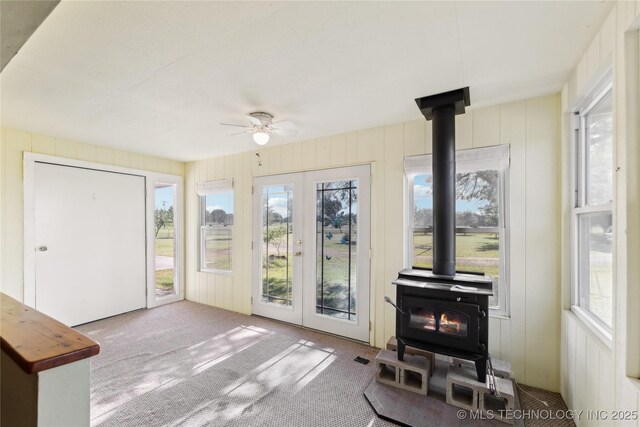 20600 Slick Rd, Kellyville, OK 74039 - sunroom / solarium featuring a wood stove and french doors