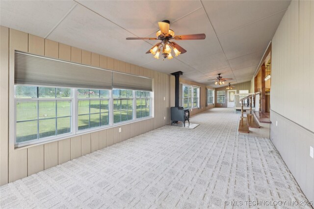20600 Slick Rd, Kellyville, OK 74039 - unfurnished sunroom featuring a wood stove