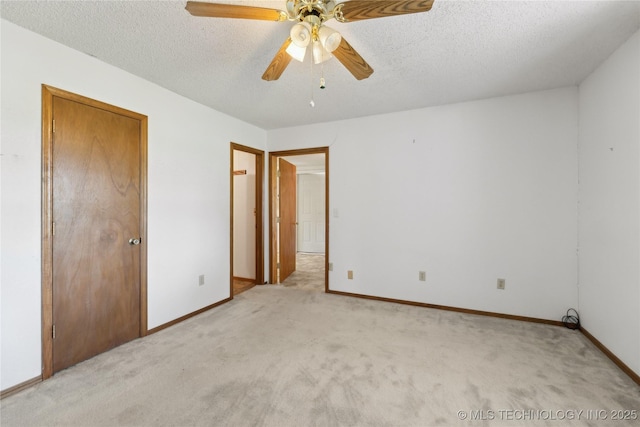 20600 Slick Rd, Kellyville, OK 74039 - unfurnished bedroom featuring light colored carpet, a textured ceiling, baseboards, and ceiling fan