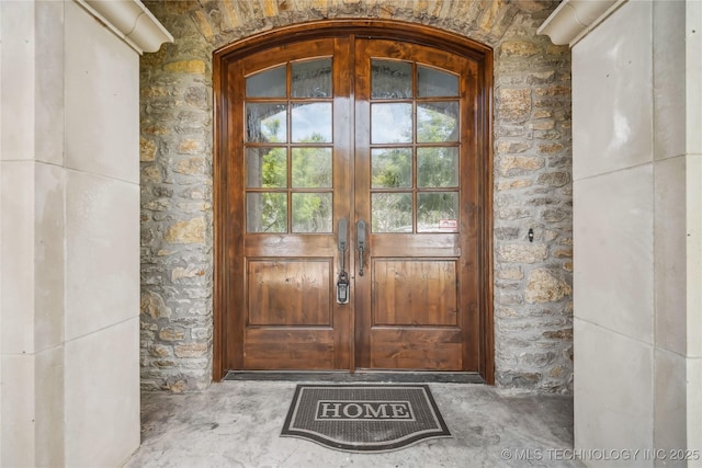 11408 S Harvard Ave, Tulsa, OK 74137 - property entrance featuring french doors and stone siding