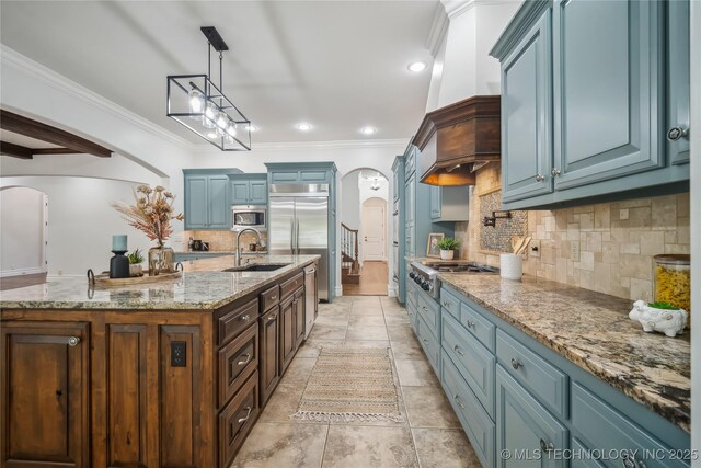 11408 S Harvard Ave, Tulsa, OK 74137 - kitchen with arched walkways, built in appliances, blue cabinetry, a sink, and ornamental molding