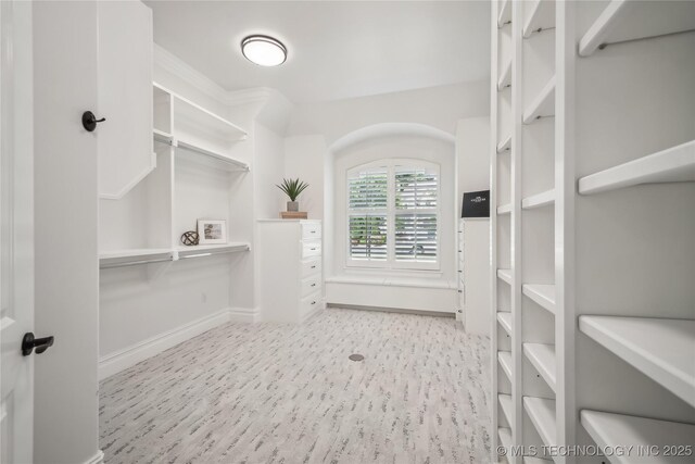 11408 S Harvard Ave, Tulsa, OK 74137 - walk in closet with wood finished floors