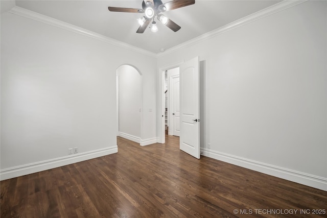 11408 S Harvard Ave, Tulsa, OK 74137 - unfurnished room with arched walkways, ceiling fan, baseboards, crown molding, and dark wood-type flooring