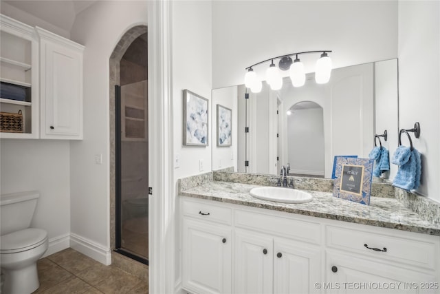 11408 S Harvard Ave, Tulsa, OK 74137 - bathroom with toilet, a shower stall, vanity, tile patterned flooring, and baseboards