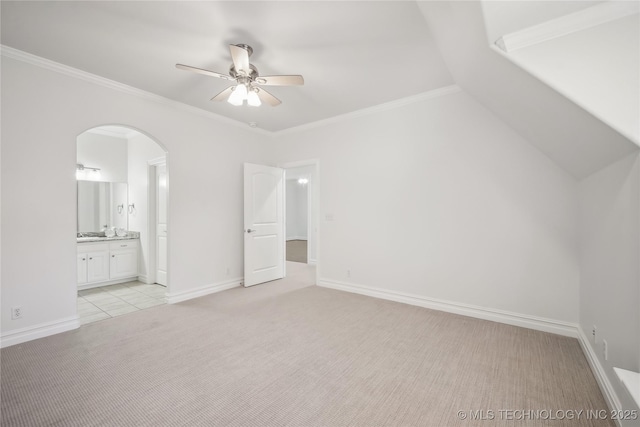11408 S Harvard Ave, Tulsa, OK 74137 - unfurnished bedroom with light carpet, arched walkways, ensuite bath, ornamental molding, and baseboards