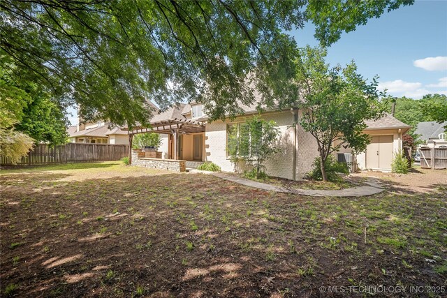 11408 S Harvard Ave, Tulsa, OK 74137 - back of house featuring a pergola, a fenced backyard, and cooling unit