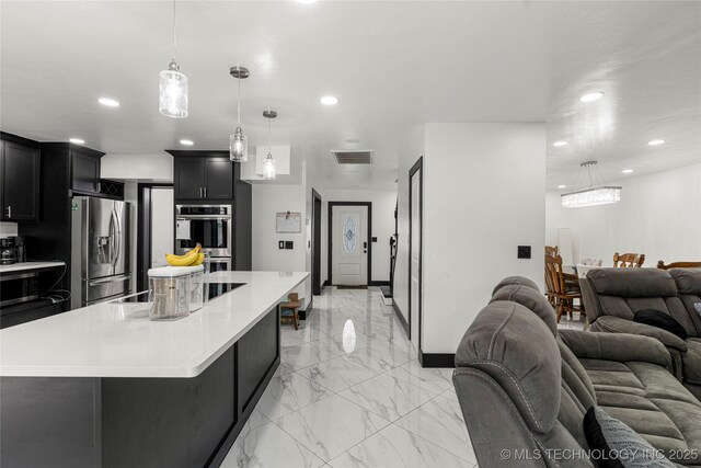 2122 E 52nd St, Tulsa, OK 74105 - kitchen with appliances with stainless steel finishes, open floor plan, recessed lighting, light countertops, and light marble finish floors