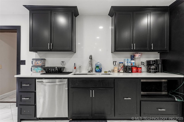 2122 E 52nd St, Tulsa, OK 74105 - kitchen featuring appliances with stainless steel finishes, a sink, light countertops, and dark cabinetry