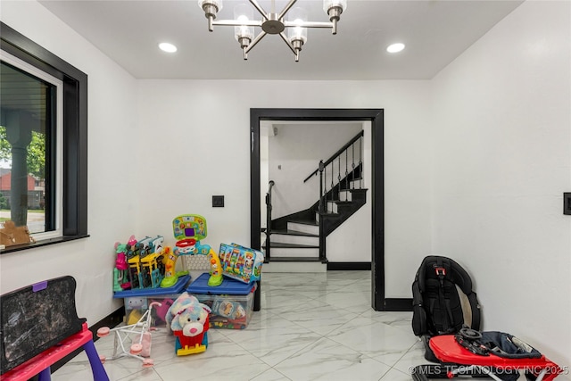2122 E 52nd St, Tulsa, OK 74105 - playroom with a chandelier, light marble finish flooring, baseboards, and recessed lighting