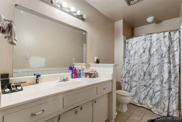 2122 E 52nd St, Tulsa, OK 74105 - bathroom featuring tile patterned floors, toilet, vanity, and curtained shower