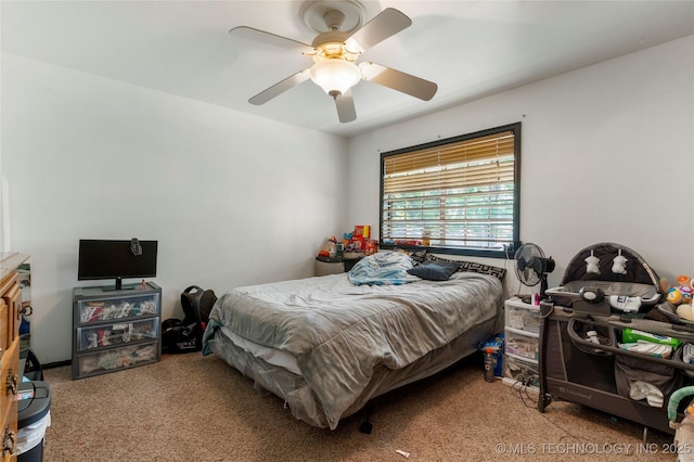 2122 E 52nd St, Tulsa, OK 74105 - carpeted bedroom featuring a ceiling fan