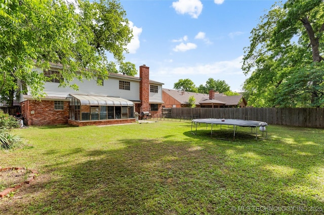 2122 E 52nd St, Tulsa, OK 74105 - view of yard featuring a sunroom and a trampoline
