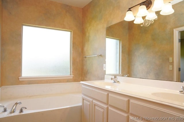717 W 39th St, Sand Springs, OK 74063 - full bath with a bath, double vanity, and a chandelier