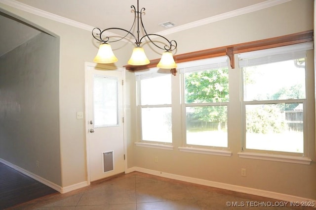 717 W 39th St, Sand Springs, OK 74063 - unfurnished dining area featuring tile patterned flooring, baseboards, crown molding, and a chandelier