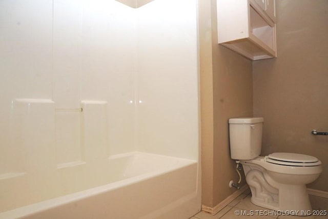 717 W 39th St, Sand Springs, OK 74063 - bathroom with toilet, tile patterned flooring, and baseboards