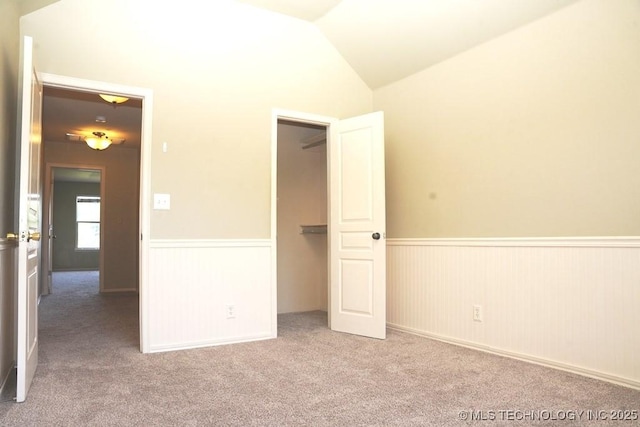 717 W 39th St, Sand Springs, OK 74063 - unfurnished bedroom featuring a wainscoted wall, carpet flooring, and vaulted ceiling
